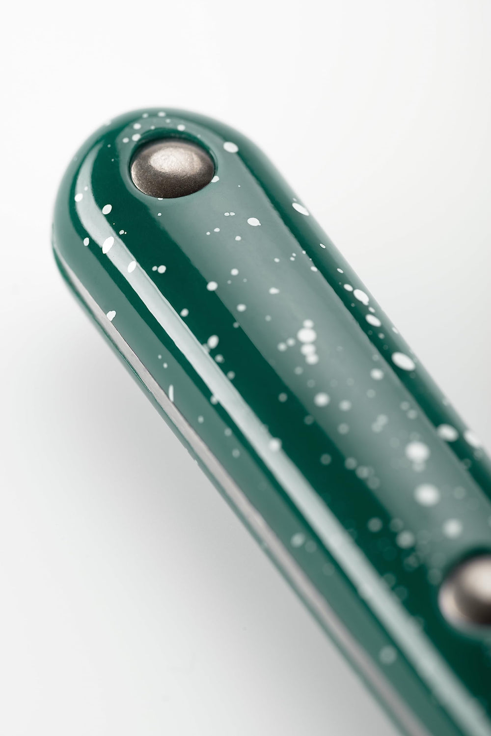 GSI Outdoors size comparison of a spoon beside a coin illustrating compact scale for packing and portability
