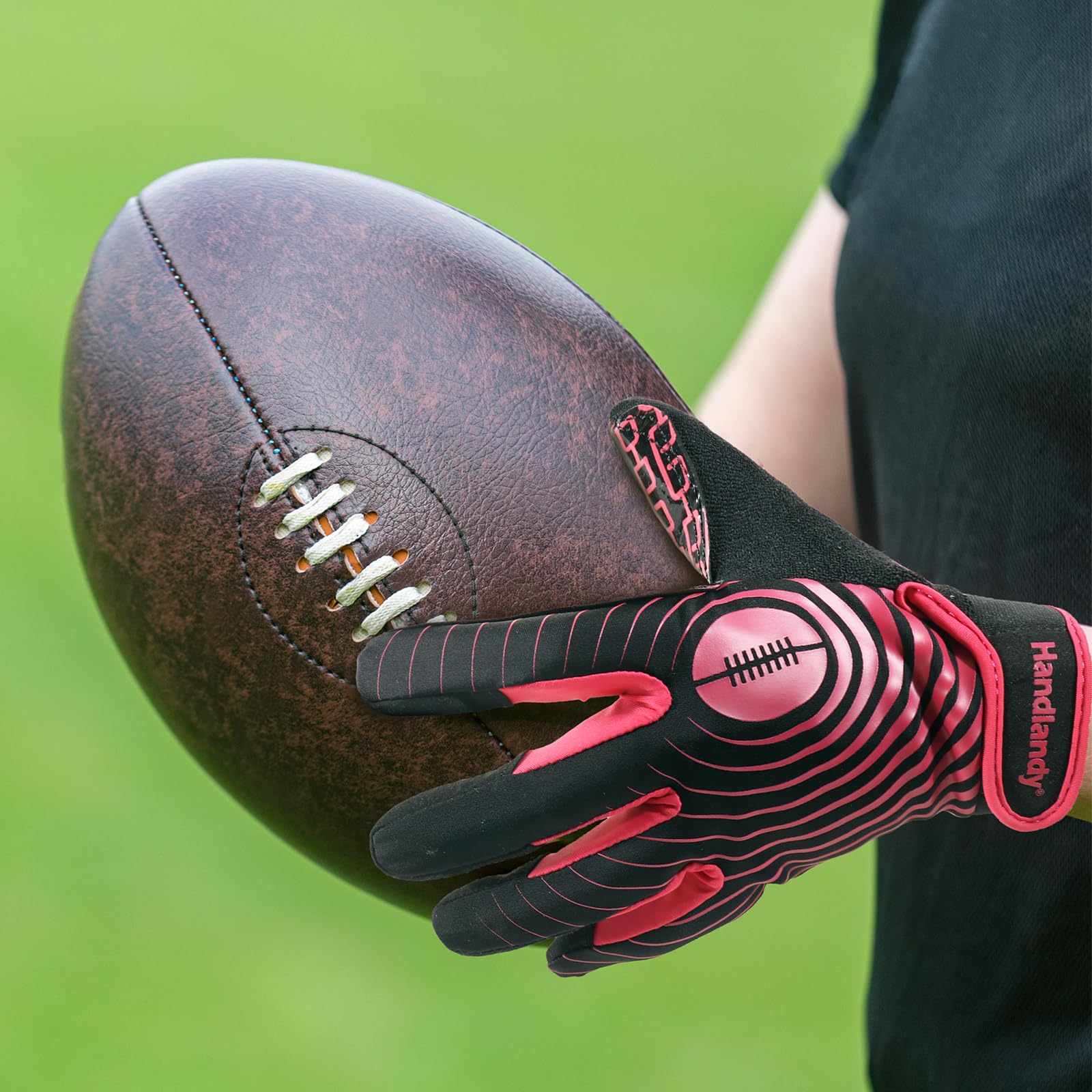 HANDLANDY gloves worn by child catching football showing improved control