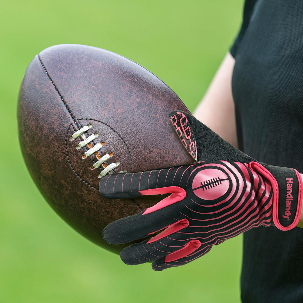 HANDLANDY gloves worn by child catching football showing improved control