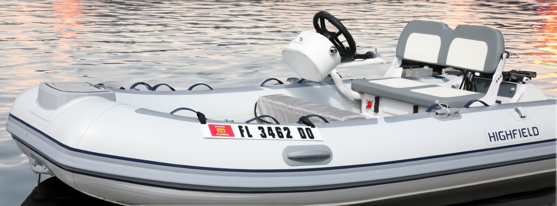 Hardline Products plate mounted on inflatable dinghy demonstrating no-adhesive protection