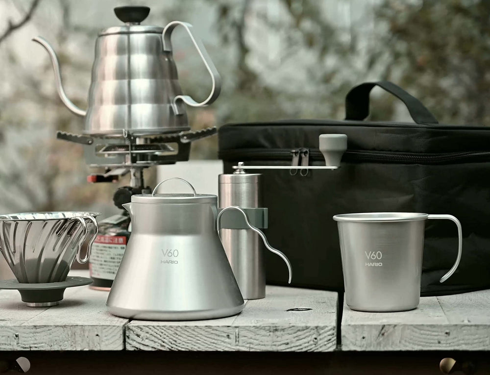 HARIO bag open with V60, server, mill and cups organized for quick brewing