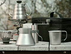 HARIO bag open with V60, server, mill and cups organized for quick brewing