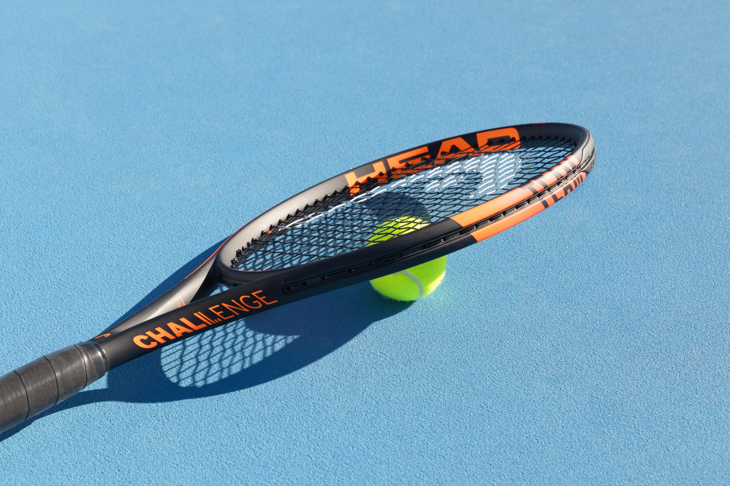 HEAD racquet beside ruler to show 27-inch length and player scale benefits