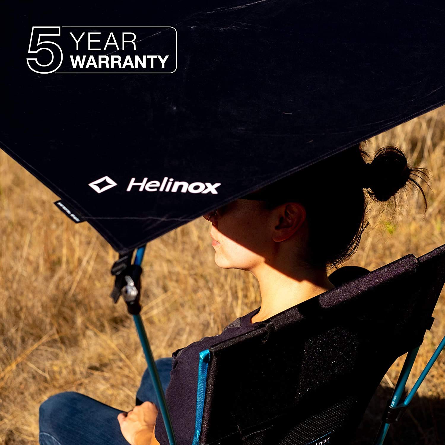 Helinox canopy on beach chair in use offering portable shade