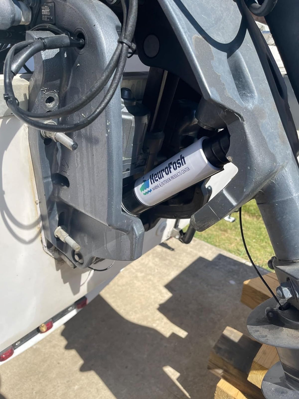 Heurofosh wedge installed over trim-tilt ram minimizing motor movement