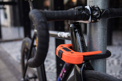 Hiplok DX locked to a bike rack demonstrating strong e-bike protection benefit