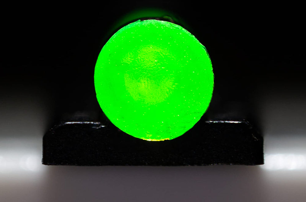 HIVIZ PM1002 beside coin for scale to show compact sight dimensions