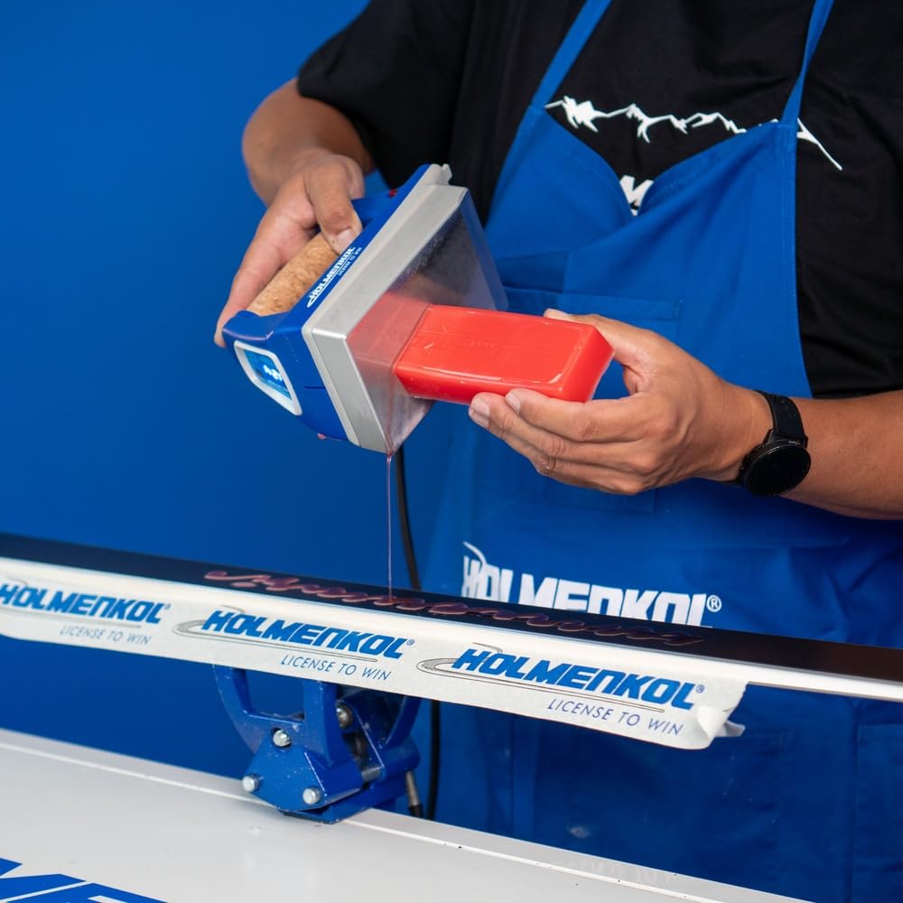 Holmenkol Beta Mix Red being ironed onto a ski base for smooth glide