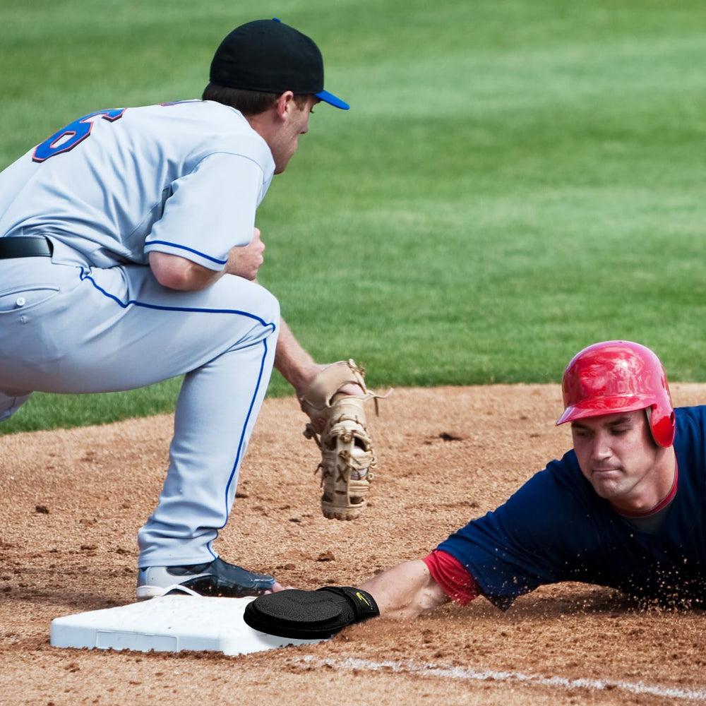 HolyElks youth player sliding into base while wearing mitt for confident baserunning