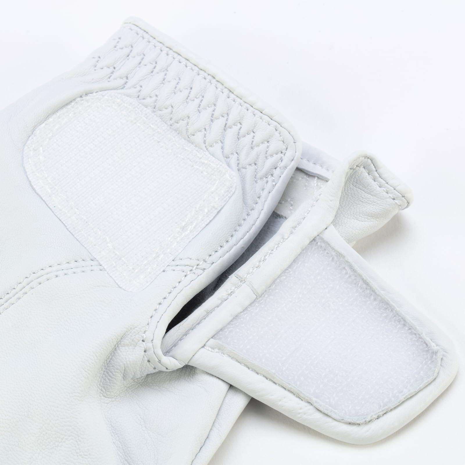 Honma glove worn during swing in course setting showing comfort and performance