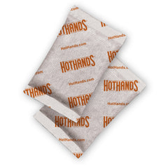 HotHands adhesive-backed detail showing secure attachment to clothing for hands-free warmth