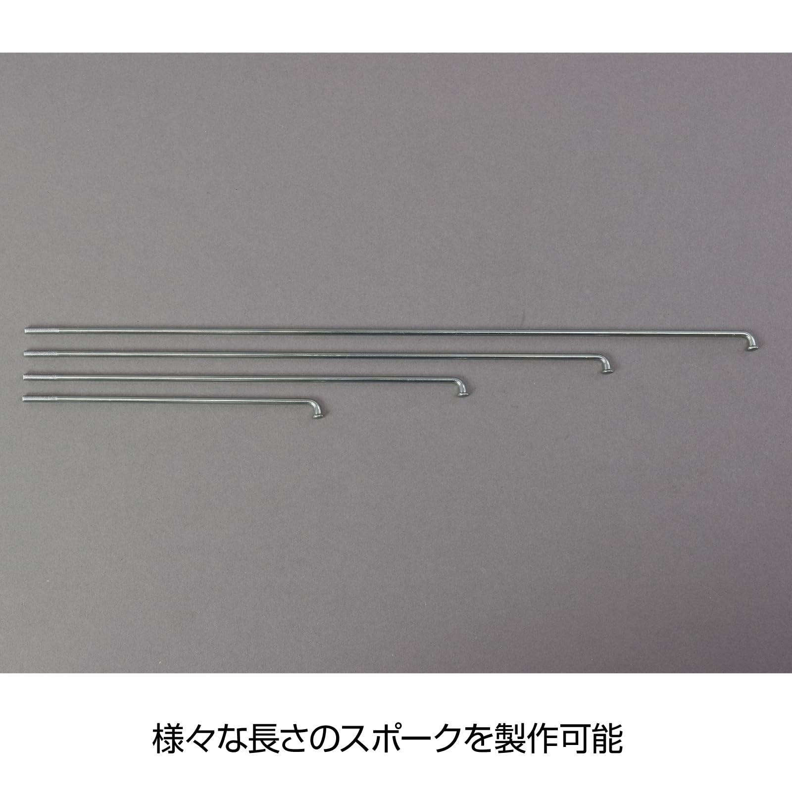 HOZAN tool threading a stainless #14 spoke demonstrating smooth installation benefit