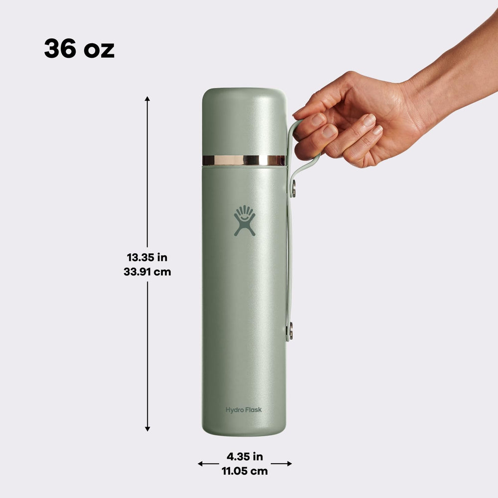 Hydro Flask pouring beverage from bottle highlighting easy pour benefit