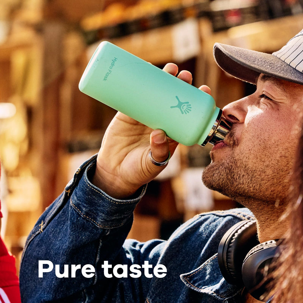 Hydro Flask tucked in a purse pocket showing travel convenience