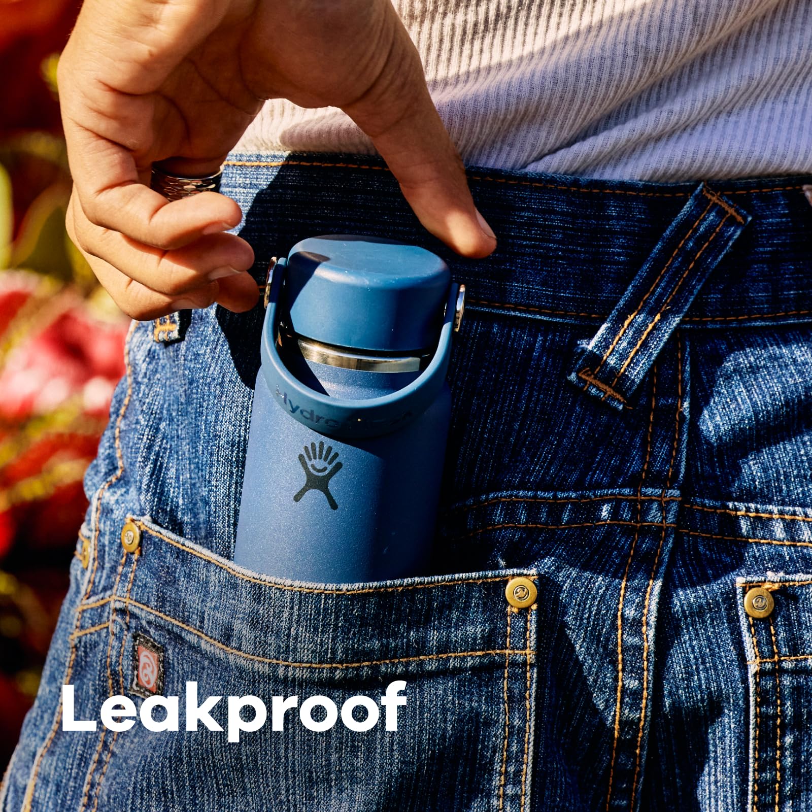 Hydro Flask beside a smartphone to show the small scale and fit