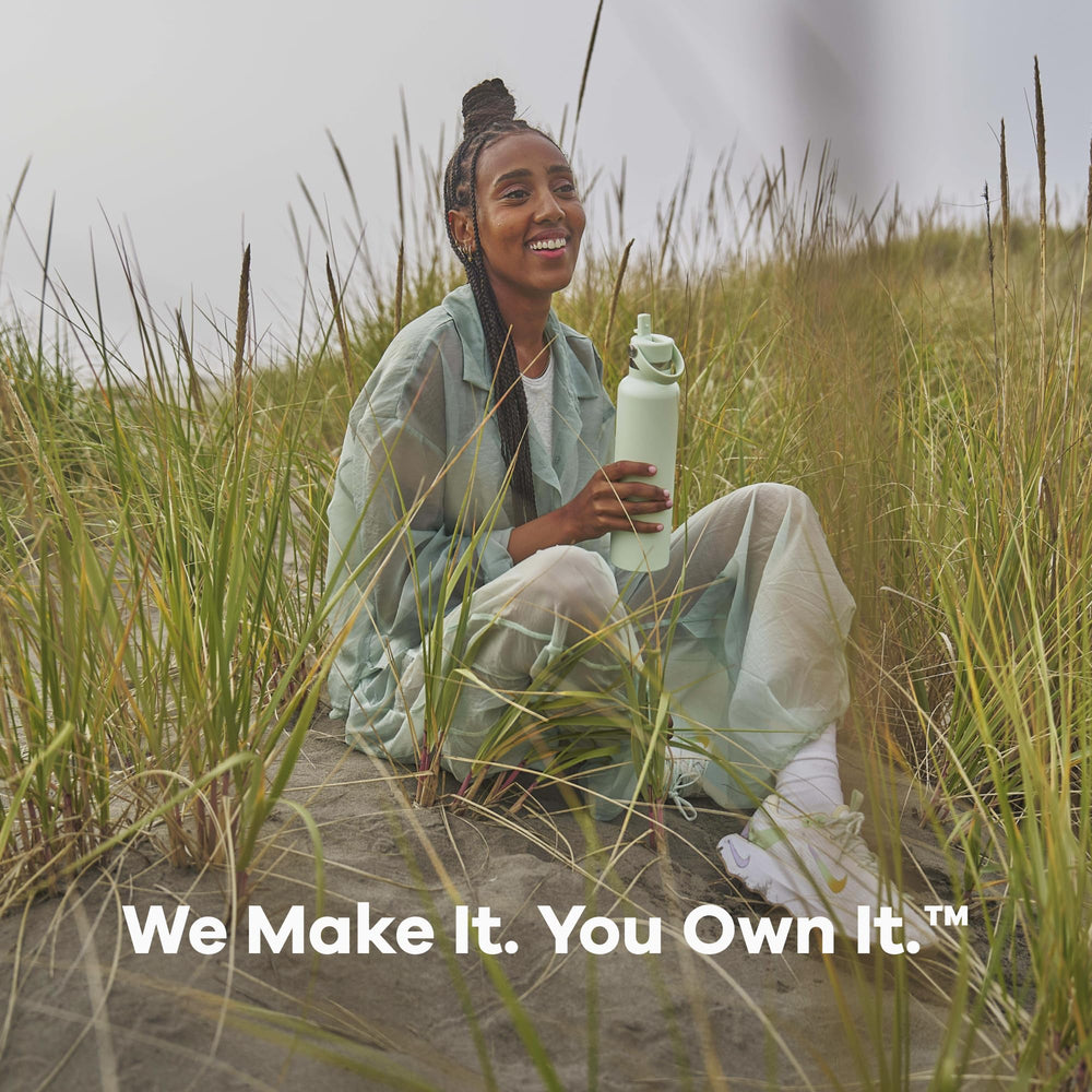Hydro Flask on hiking trail in lifestyle scene showing rugged outdoor portability benefit