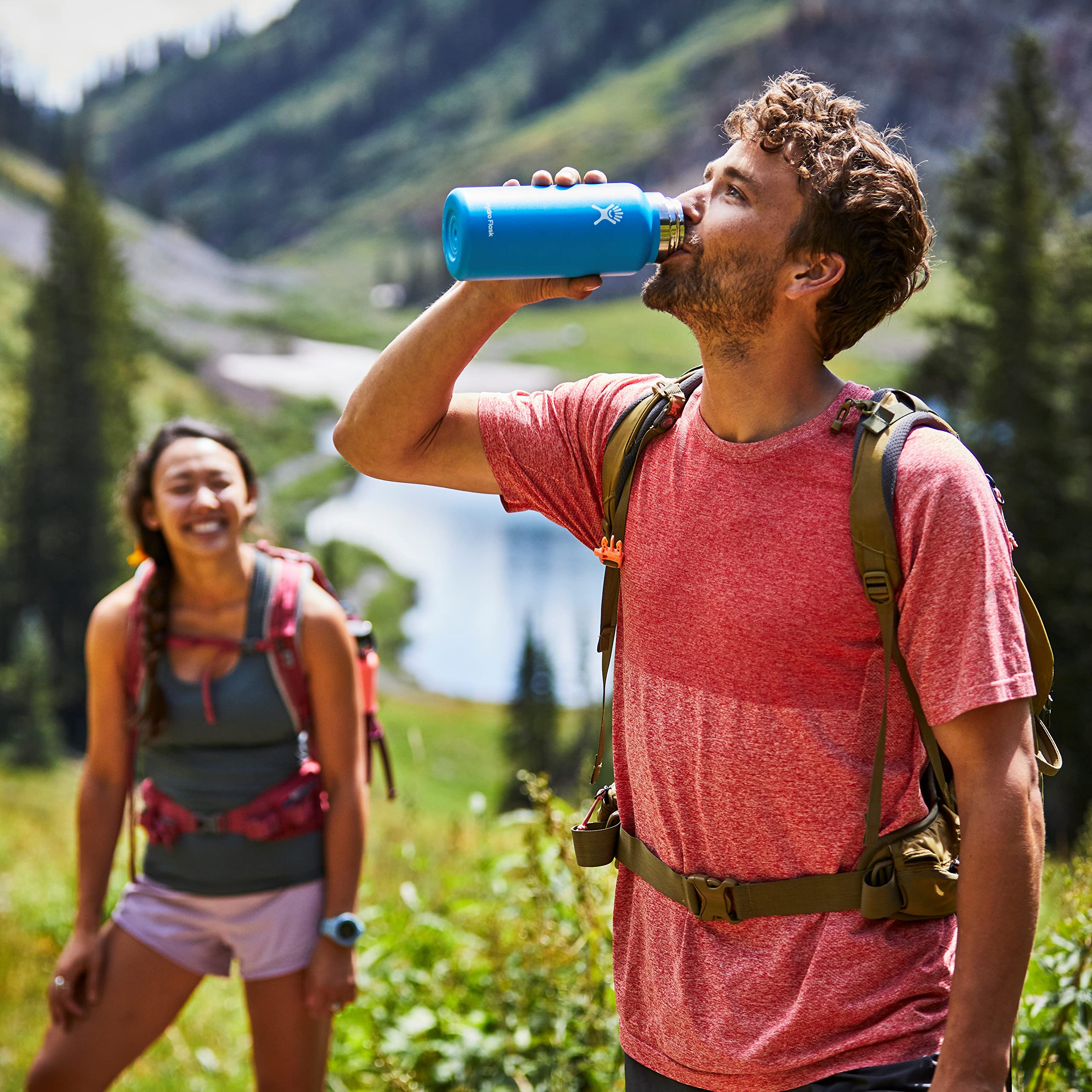 Hydro Flask 32 oz on trail next to gear showing size and capacity