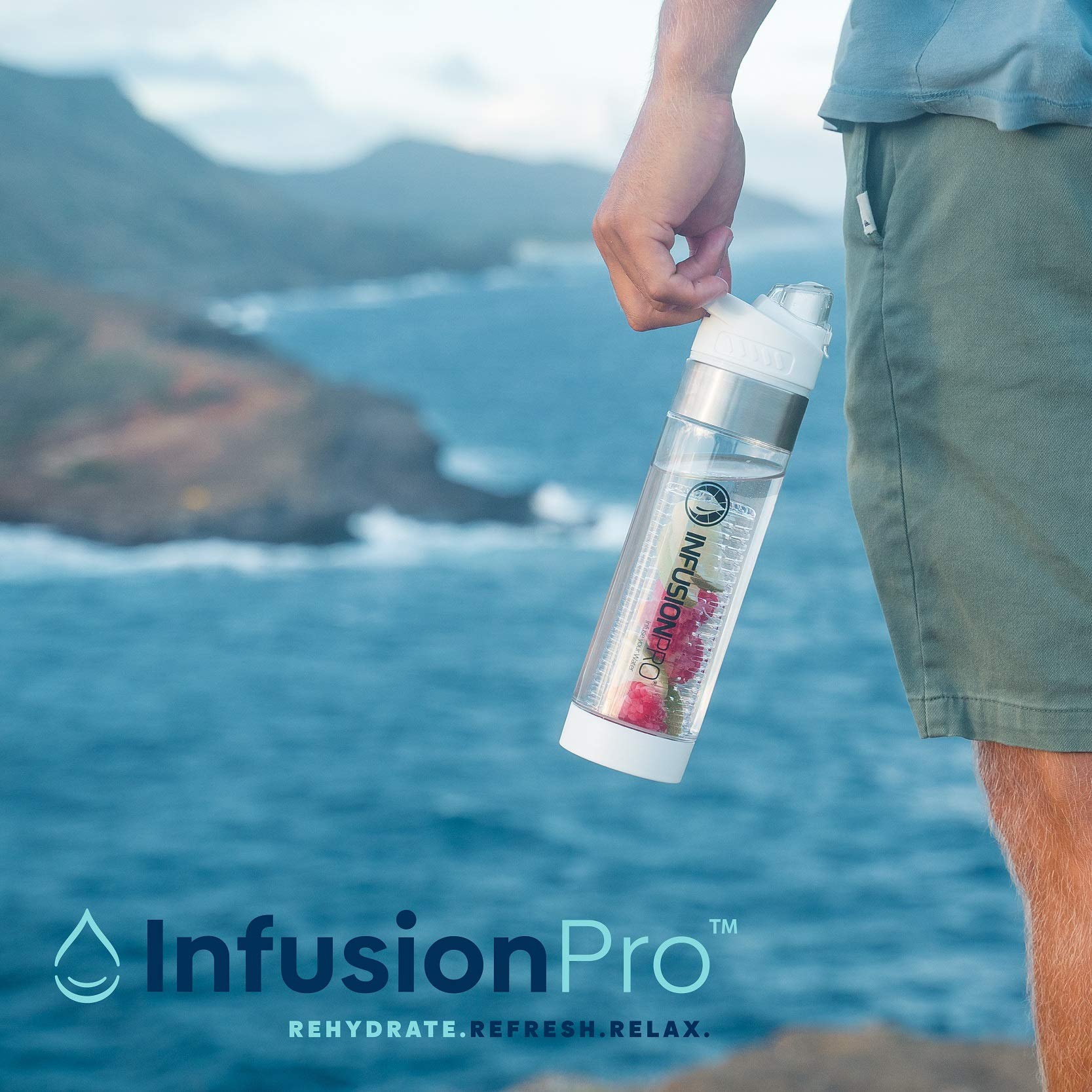 Infusion Pro bottle in use at gym next to towel showing leak-proof seal and easy access drinking