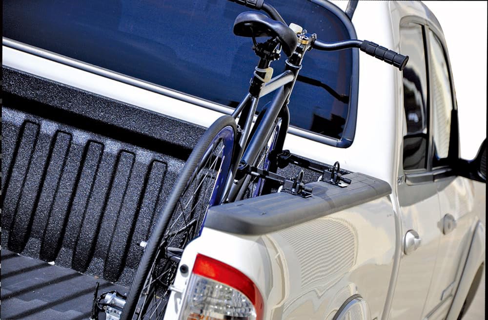 INNO RT202 lifestyle shot with truck and bike ready for camping adventure