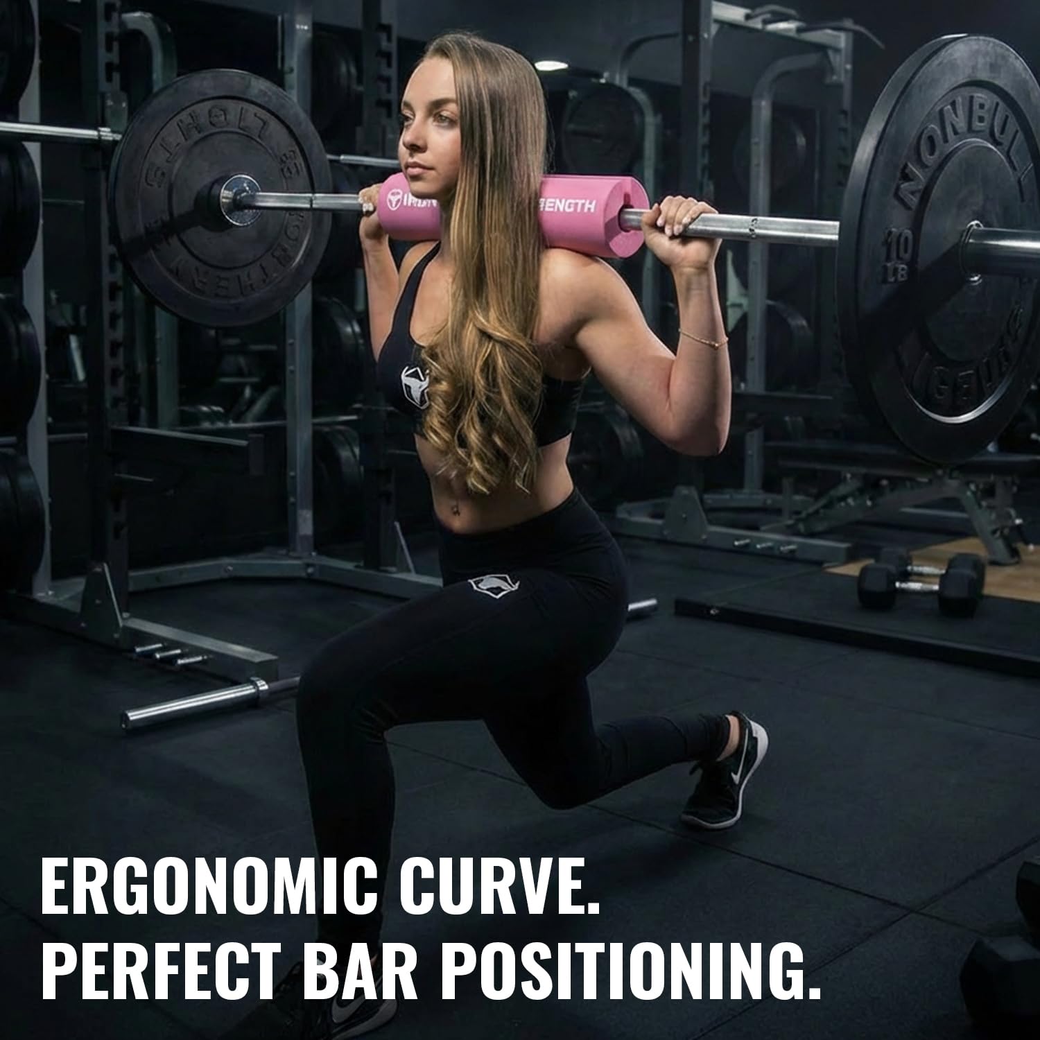 Iron Bull Strength pad next to barbell showing compact size and easy portability