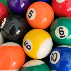 ISPiRiTo balls racked on a pool table in play, demonstrating clear numbers and smooth contact