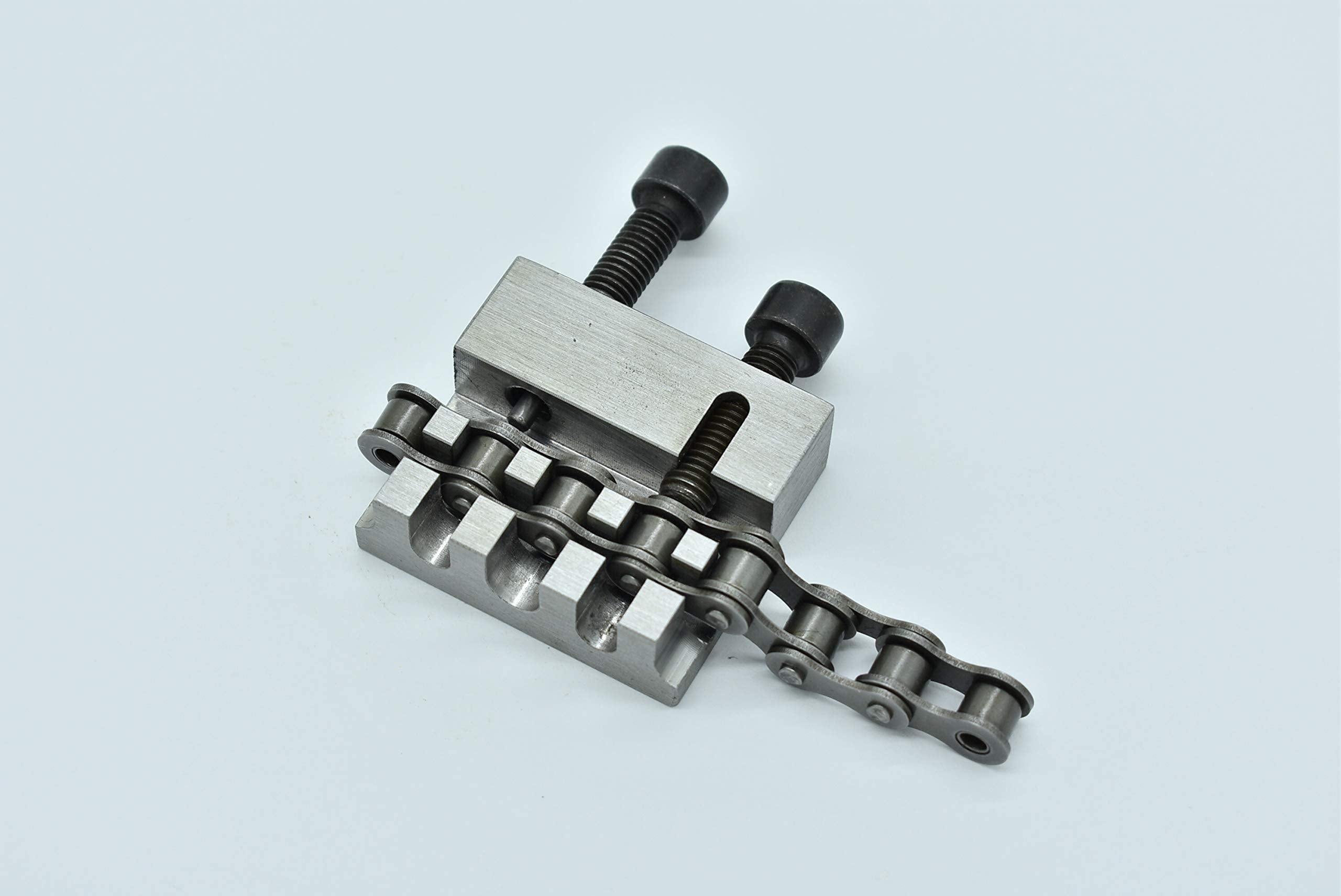 JDT Metdeinso next to a ruler to show 60x50x16mm size for portable workshop convenience