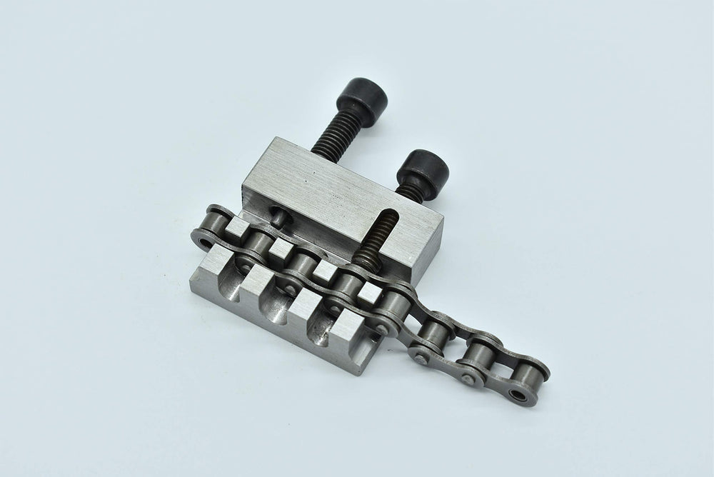 JDT Metdeinso next to a ruler to show 60x50x16mm size for portable workshop convenience