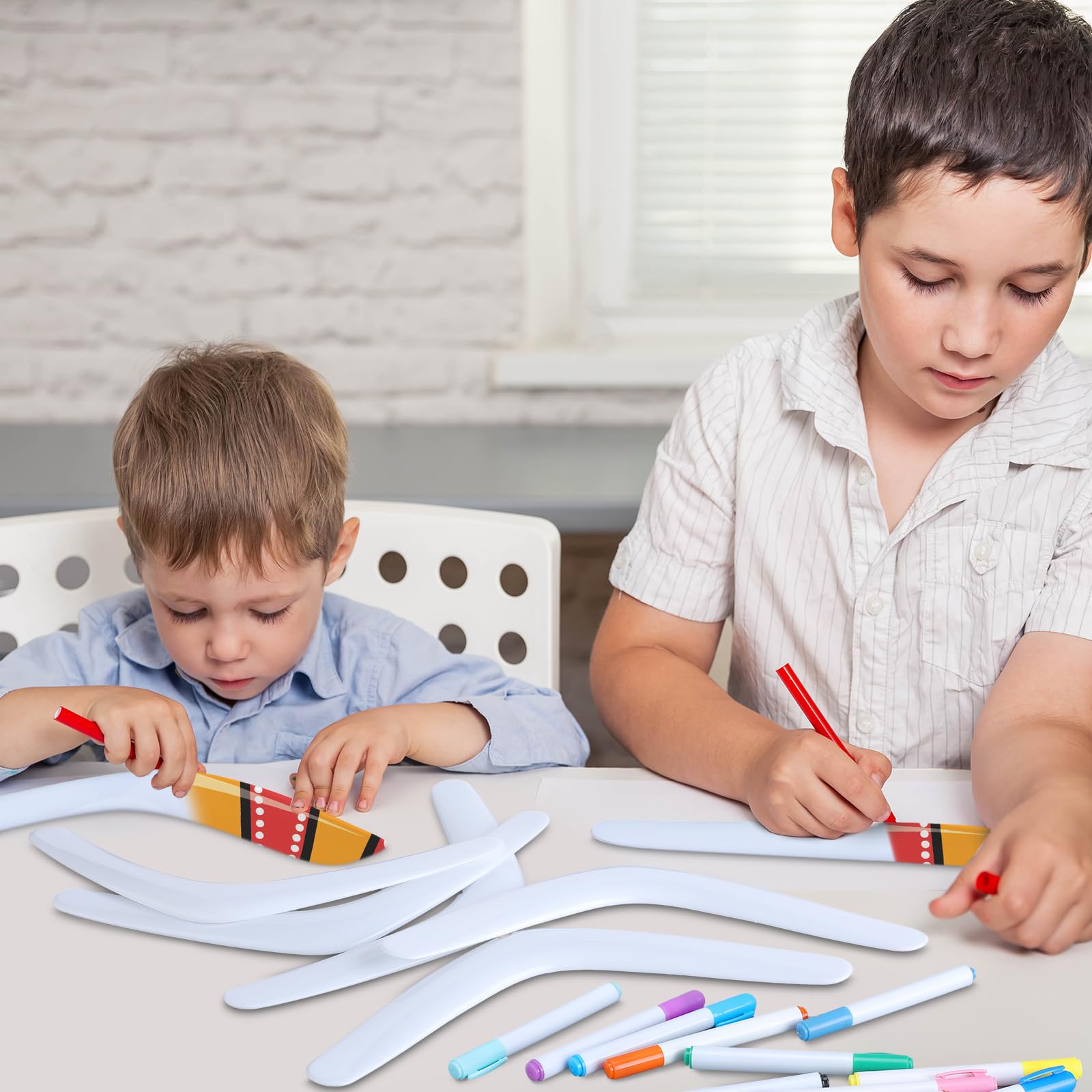 JellyArch classroom scene with students decorating boomerangs for group games