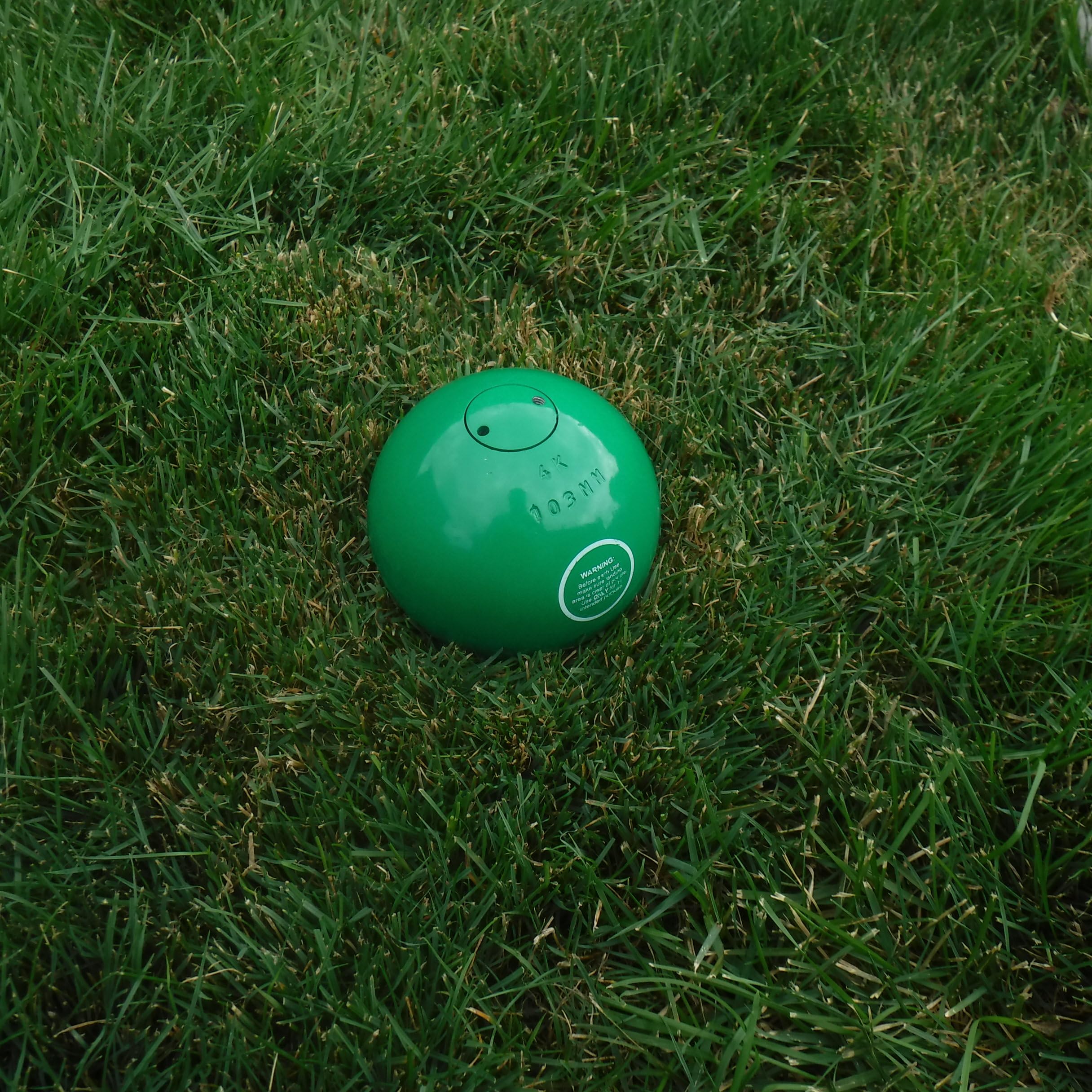 JOSOBO shot put placed in throwing circle illustrating real-use training benefit