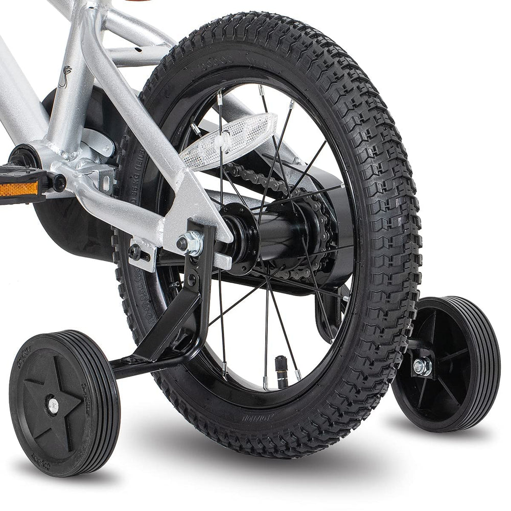 JOYSTAR child riding the silver 16 inch bike outdoors demonstrating easy learning