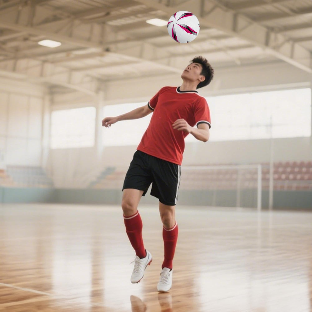 JPHNAN futsal ball in play on indoor court illustrating improved control during drills.