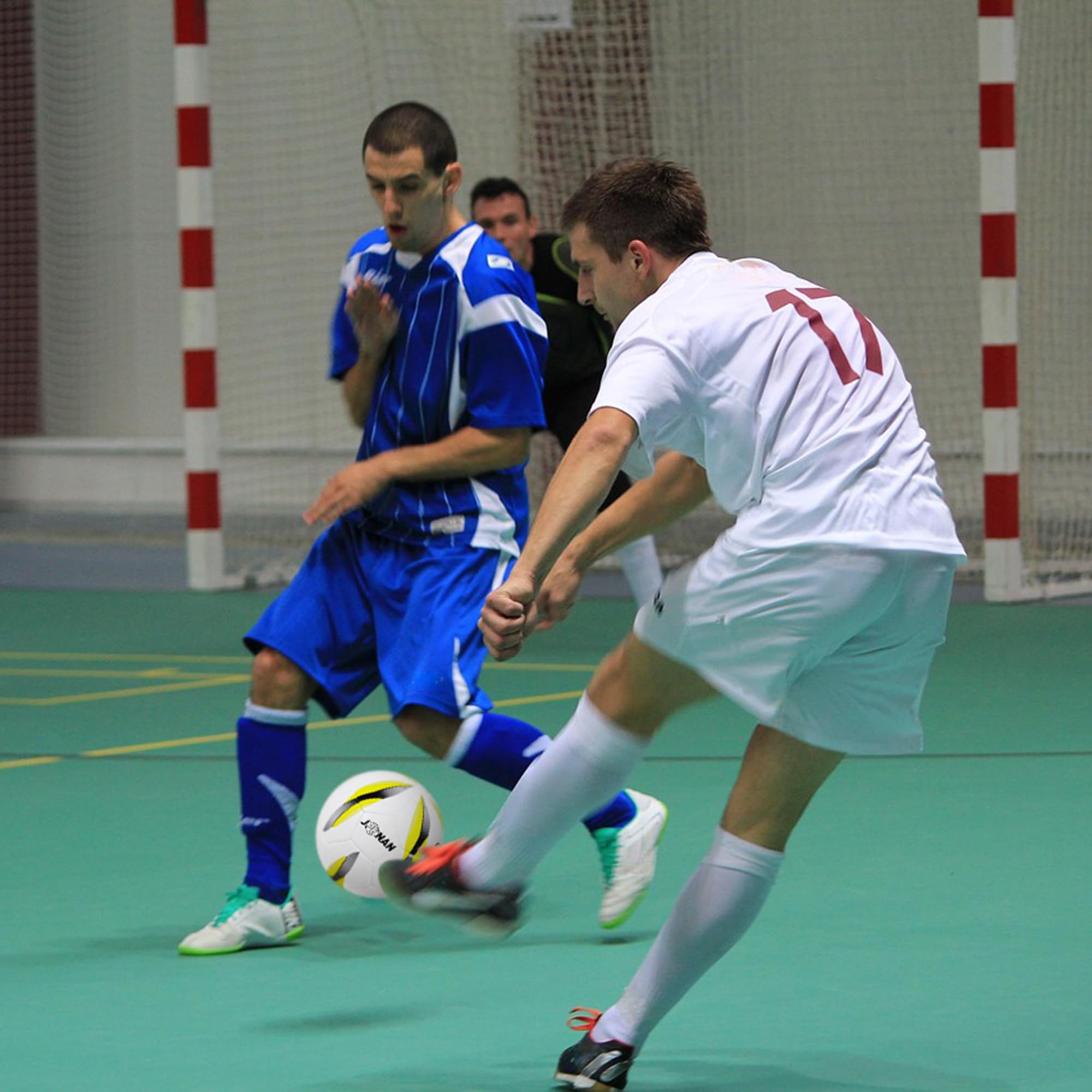 JPHNAN ball in use on indoor court demonstrating low-bounce control during drills