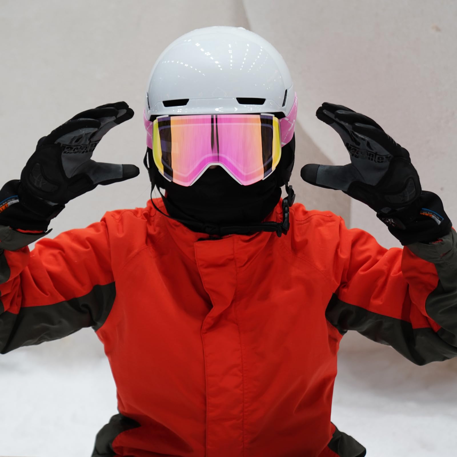 JQF Gear size comparison with hand and helmet to show scale