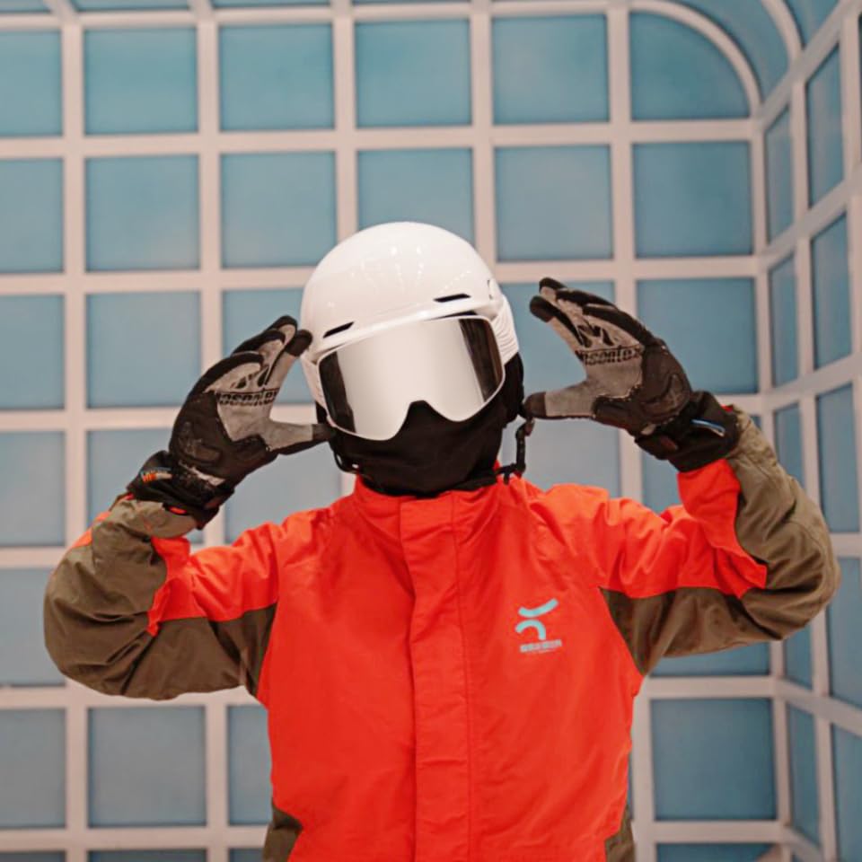 JQF Gear snowboarder wearing goggles showing clear vision benefit