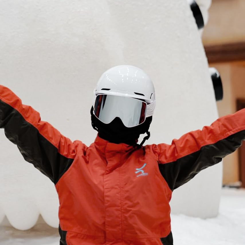 JQF Gear goggles in hand showing size scale and portability