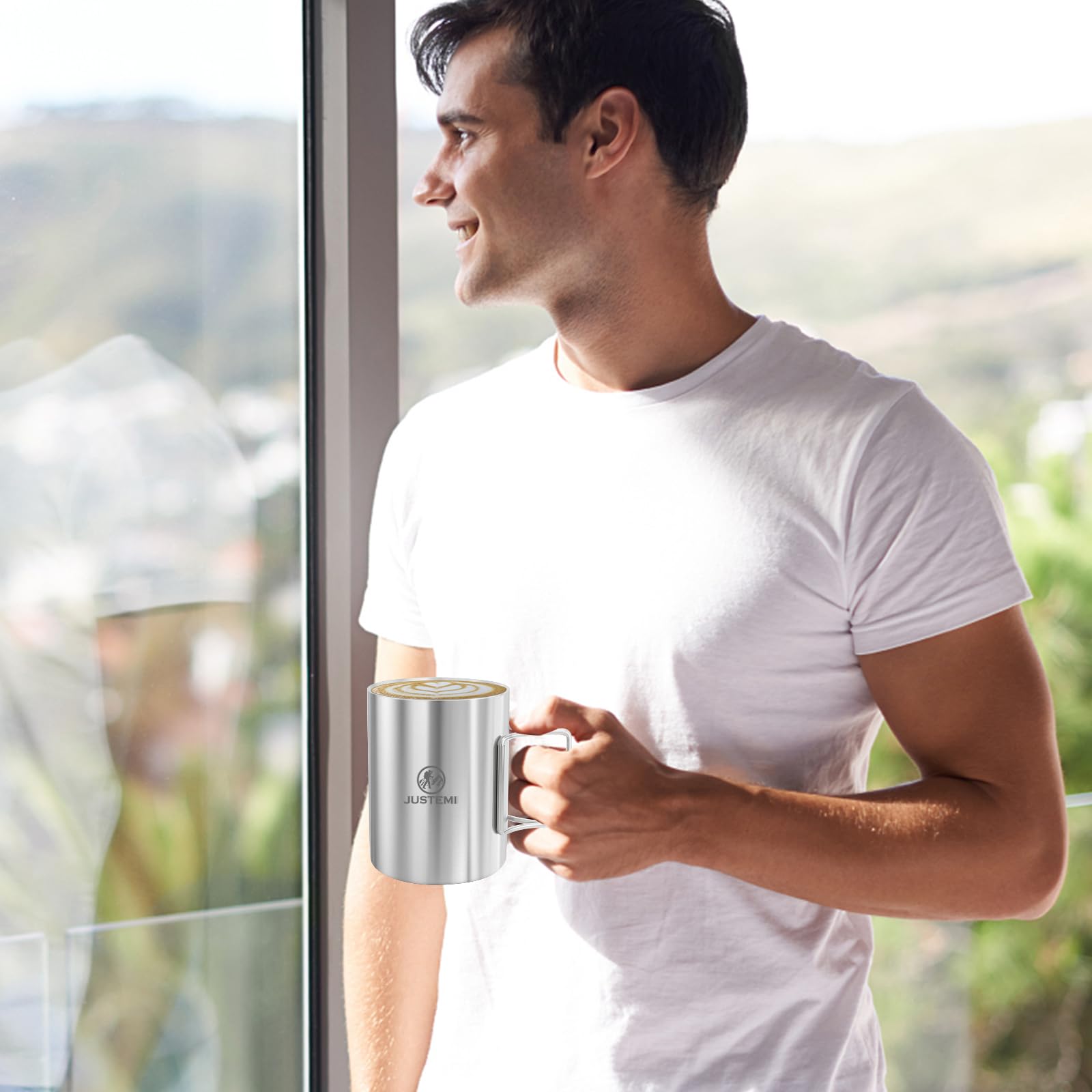 JUSTEMI mug held in hand to show 14oz scale and comfortable grip for drinking on trail
