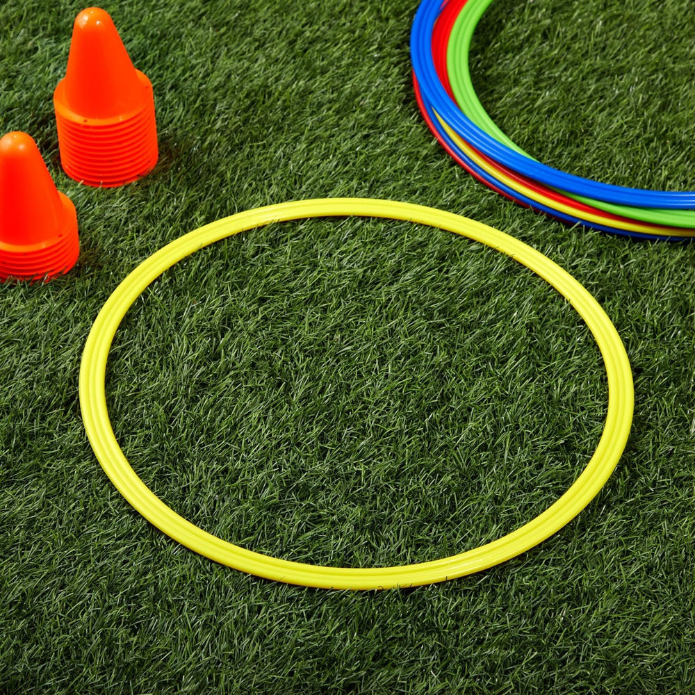 Juvale agility rings held by coach demonstrating portability and quick setup