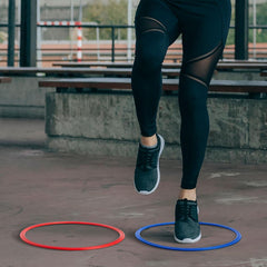 Juvale agility rings laid flat on gym floor for safe, low-profile training