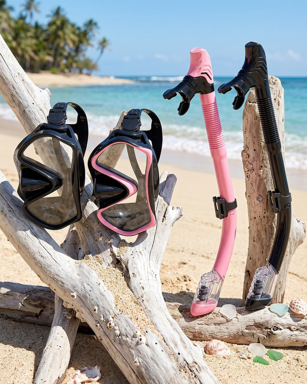 Jwintee mask and snorkel next to a hand showing compact travel scale