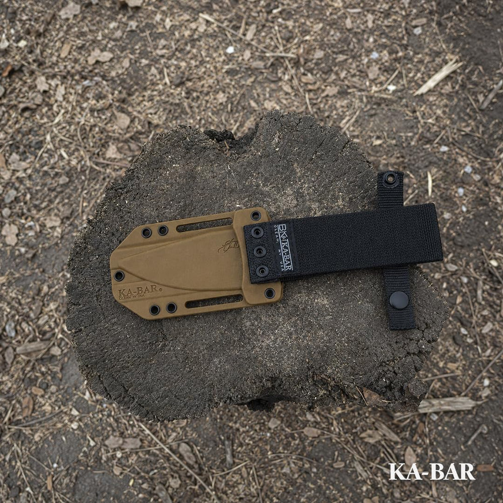 KA-BAR BK18 on campsite cutting rope showing practical outdoor utility