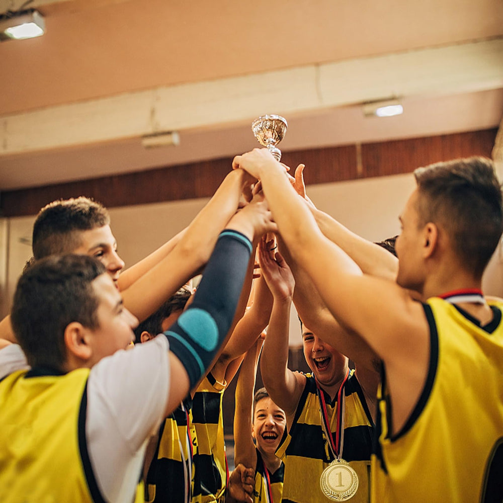 Kabcifea medals in a hand showing 5cm scale and easy handling benefit