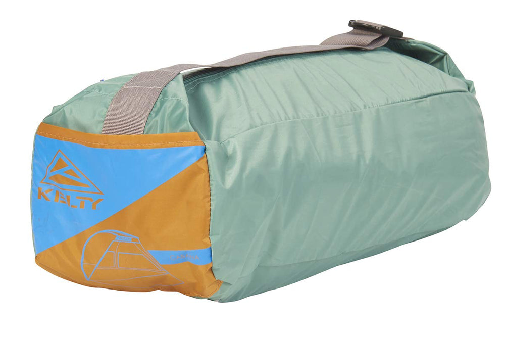 Kelty Cabana set up on a beach with family enjoying protected shade
