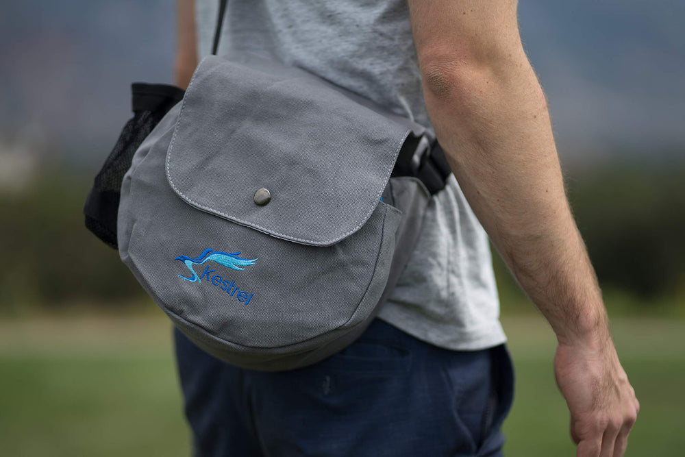 Kestrel gray shoulder bag front showing storage and easy carry benefit