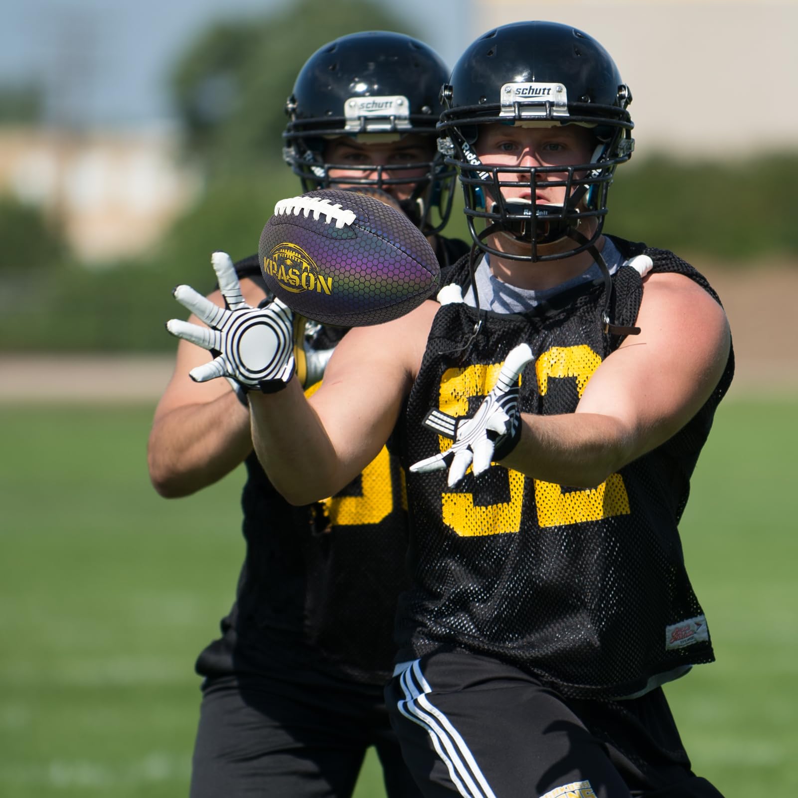 KPASON football being kicked on grass demonstrating playability and visual impact