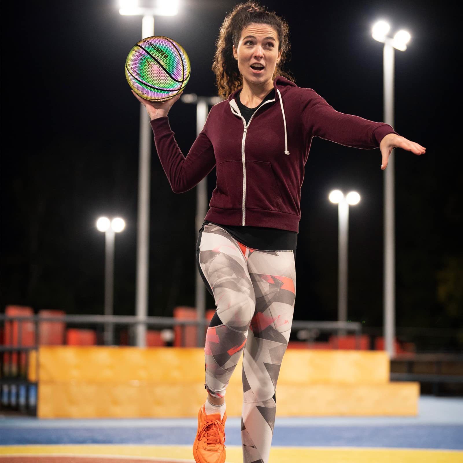 KPASON basketball held to show scale and comfortable size for women players
