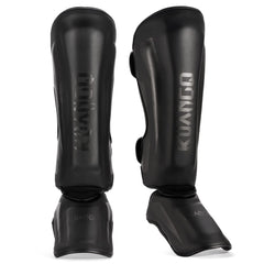 KUANG QUAN front view of shin guards showing padded protection and straps