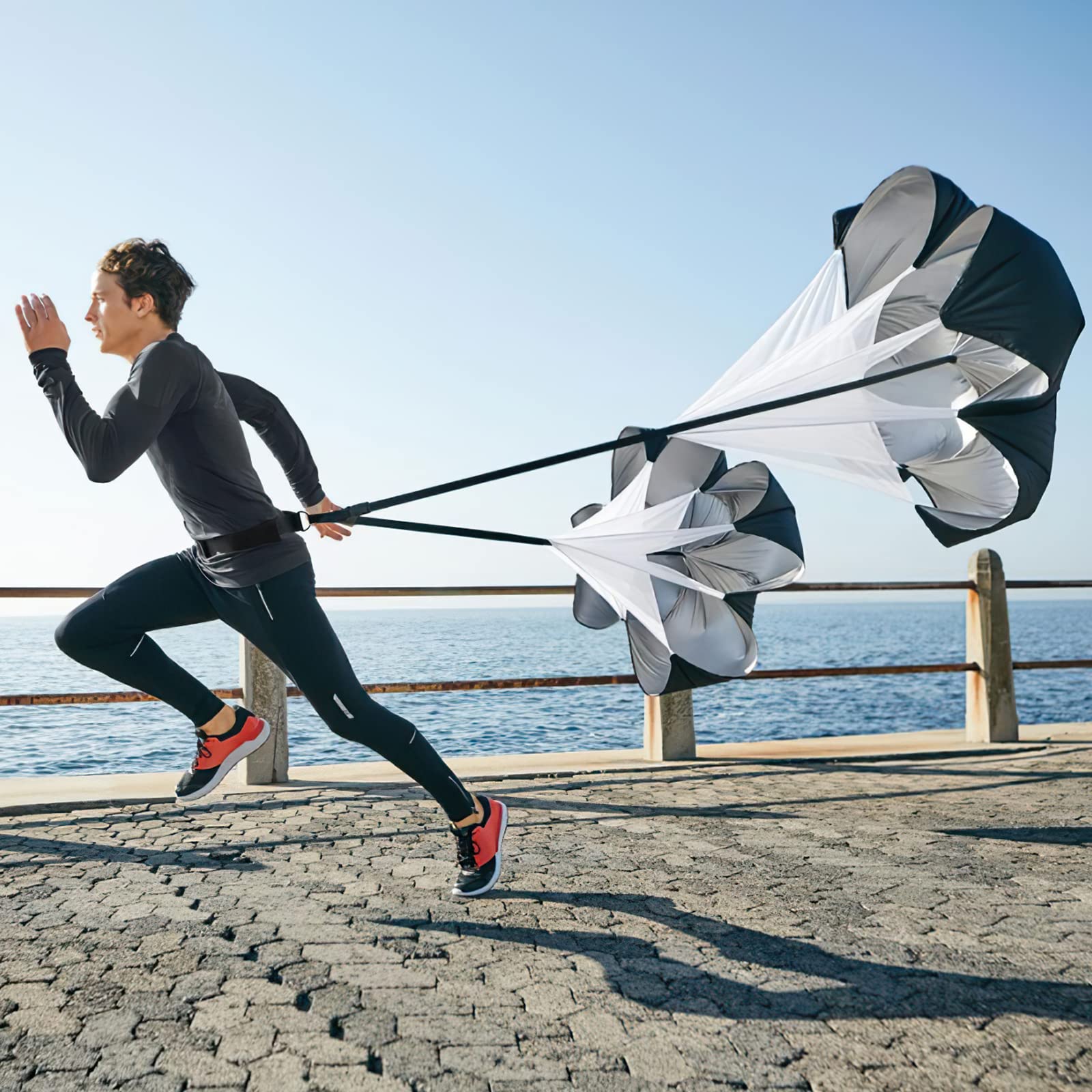 KUYOU athlete sprinting with chute to develop acceleration and explosive power
