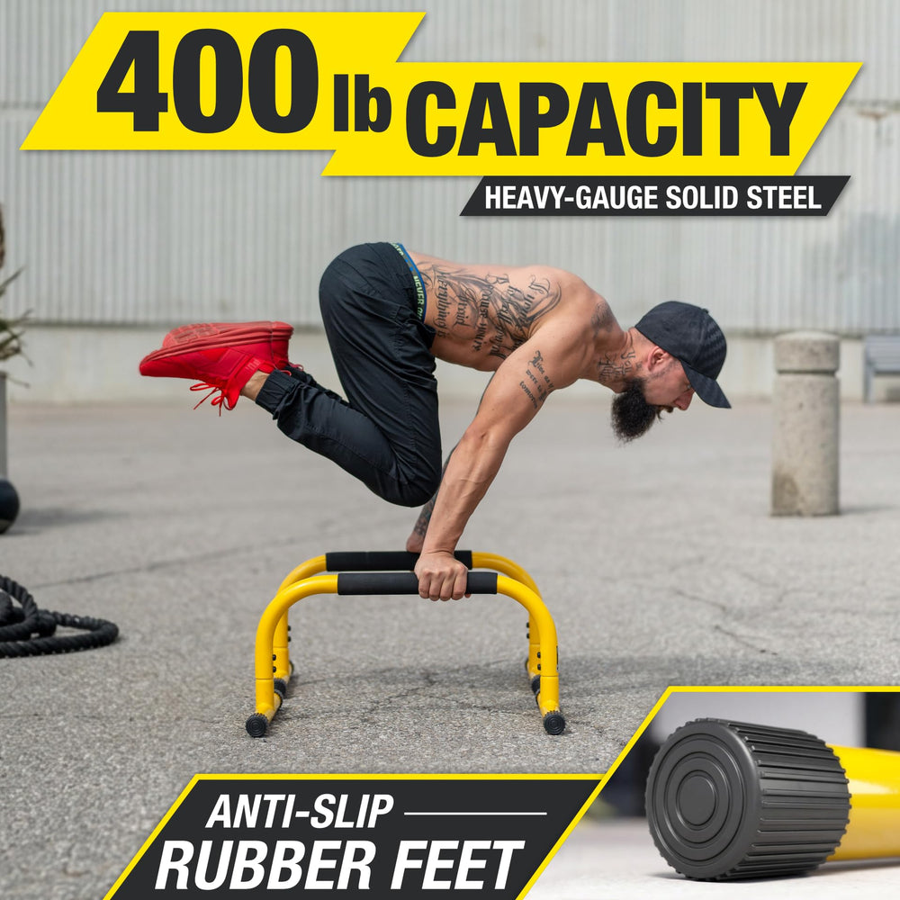 Lebert Fitness parallettes beside a water bottle to illustrate compact size and portability