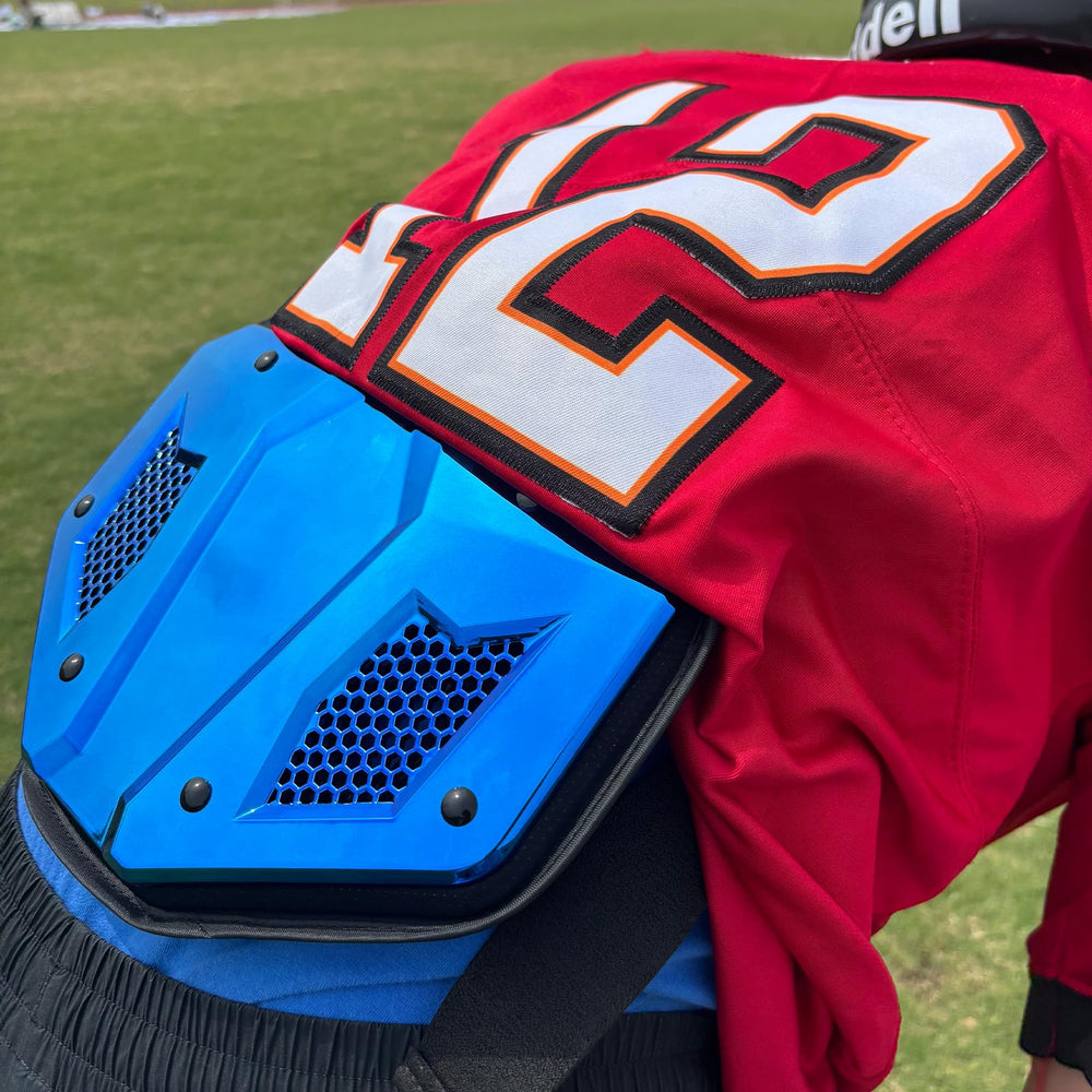 LeCool back plate mounted on shoulder pads demonstrating secure fit and stable placement