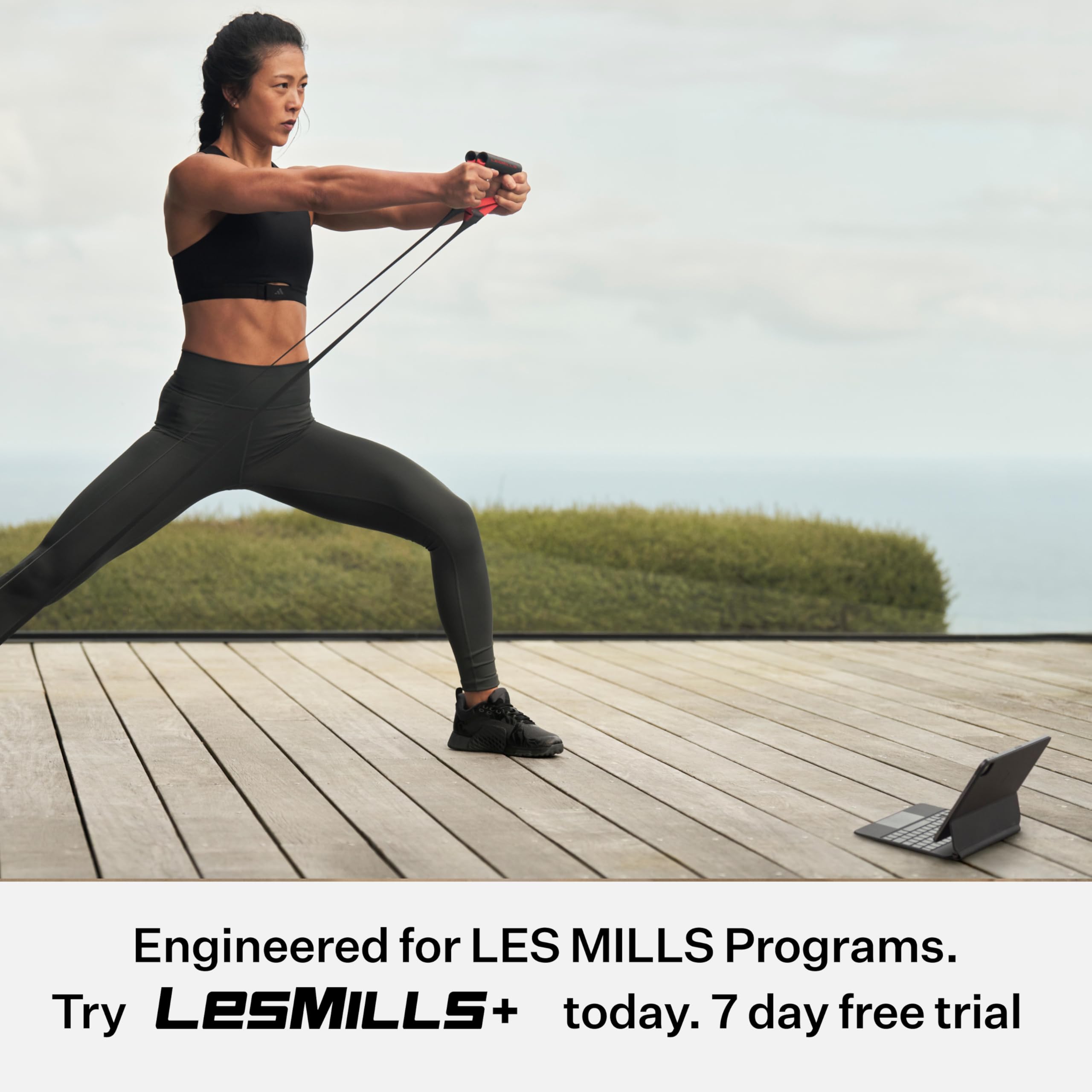 Les Mills SMARTBAND Extreme lifestyle studio scene showing band use in guided workout setting